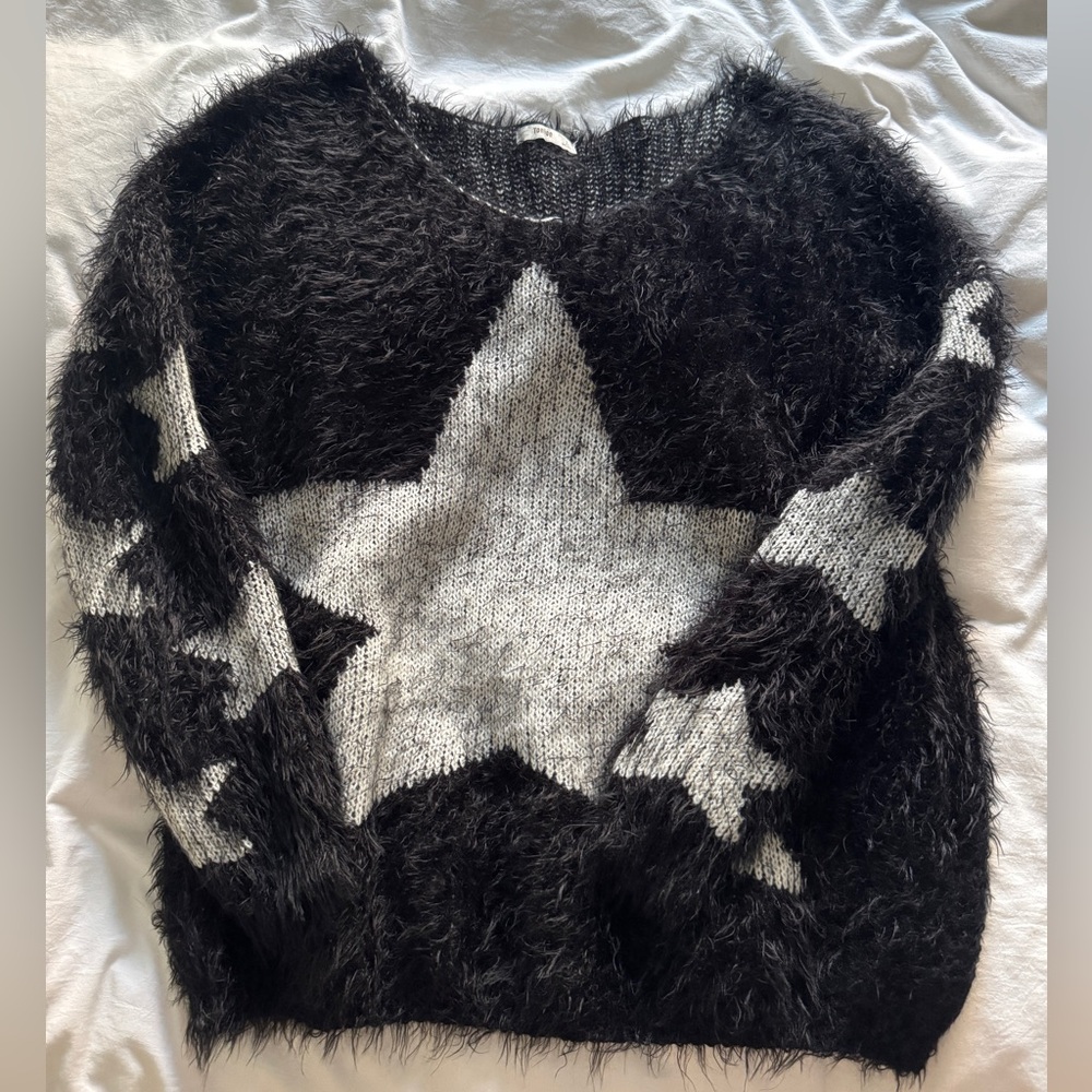 Black and grey frayed star sweater